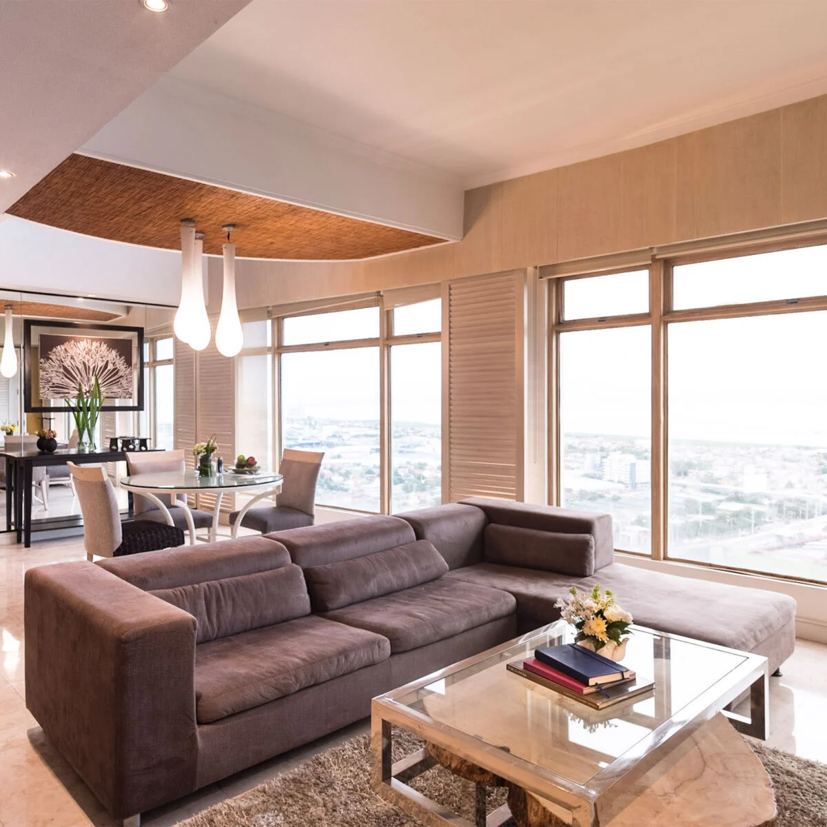 Light spilling through the panoramic windows of a Vivere suite