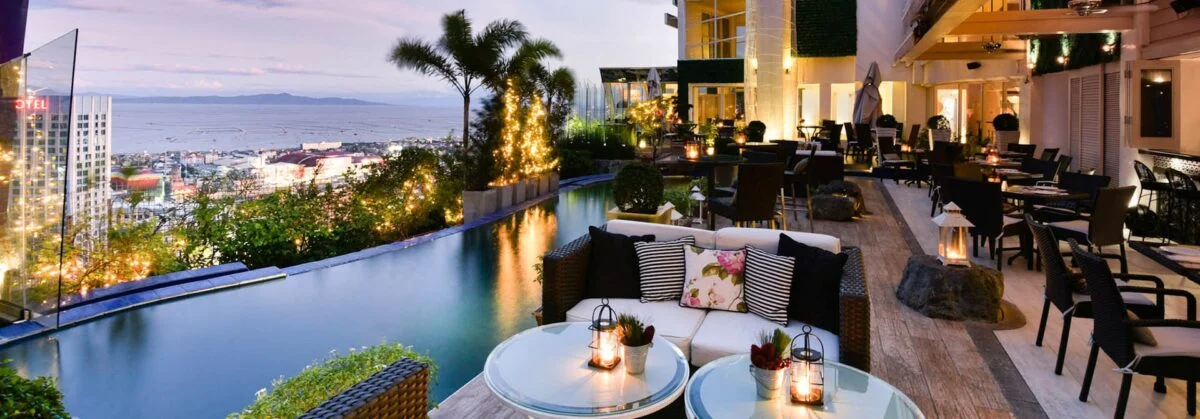 Lanterns and tables above the city at The Nest